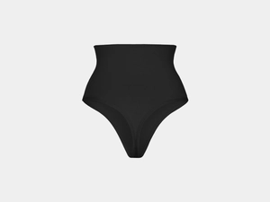 Macro detail of seamless high-waist black thong with elastic ribbed tummy control fabric