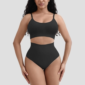 Detailed close-up of black ribbed seamless lingerie set showing slim fit and elastic texture