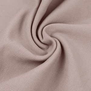 Macro detail of breathable knitted shapewear fabric in dusty pink with soft textures