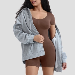 Detail of seamless brown short sleeve bodysuit paired with grey oversized zip hoodie