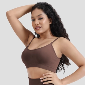 Detail of coffee brown seamless sports bra with wide elastic band and thin straps