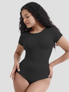 Macro detail of high-elasticity black bodysuit showing compression fabric texture and stitching