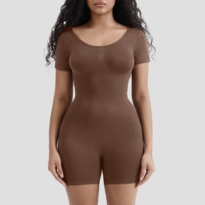 Detail of dark brown ribbed bodysuit showing seamless shaping fabric and short sleeve design