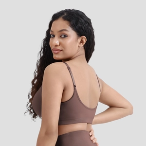 Detailed back view of chocolate seamless sports bra with U-shaped cut and thin straps