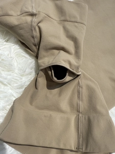 Close-up of seamless shaping bodysuit with high-stretch fabric and functional opening