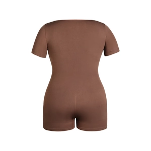 Detail of coffee brown short sleeve shapewear showing ribbed waist compression fabric