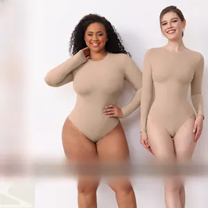 Detail view of slim fit long sleeve bodysuit showing high elasticity on two models