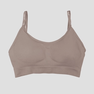 Detail of adjustable straps and seamless ribbed hem on seamless sports bra