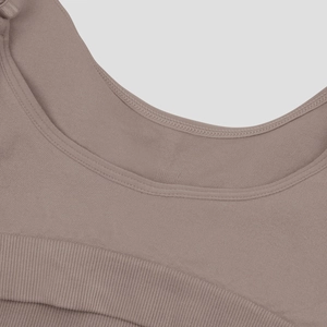 Detailed close-up of seamless sports bra stitching with reinforced neckline and ribbed hem
