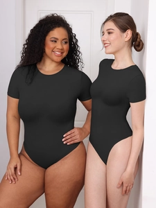 Detail of black short sleeve bodysuit showing high elasticity and shaping fit on models