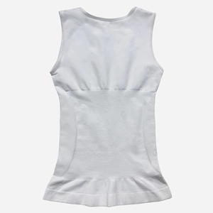 Detailed view of white seamless compression shapewear tank top with wave hem design