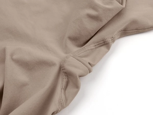 Macro detail of the flat-lock stitching and high-elastic knit fabric on the shapewear