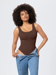 Detailed view of brown ribbed bodysuit featuring wide straps and deep U-neckline design