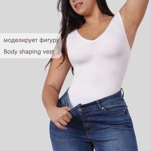 Detailed view of white body shaping vest with U-neck design on a female model