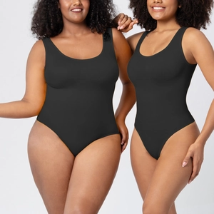 Detail view of black seamless bodysuit with U-neck design on diverse body types