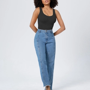 Detail shot of black slimming bodysuit paired with light blue high waist jeans