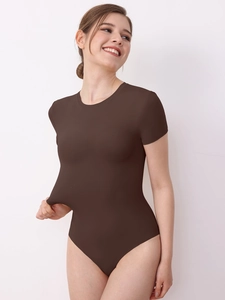 Detail of dark brown short sleeve bodysuit showing high elasticity and stretchable fabric