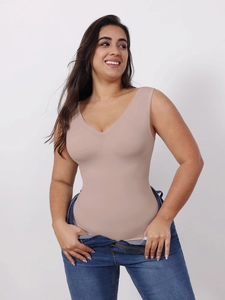 Detail of nude seamless shapewear tank top with V-neck showing slimming compression effect