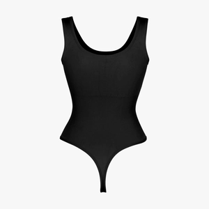 Detail of black seamless bodysuit featuring ribbed tummy control and wide straps