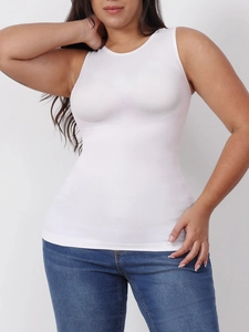 Detail showing high-elastic white seamless shaping tank top paired with blue jeans