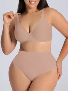 Detail view of seamless V-neck sports bra and high-waisted shorts set in beige