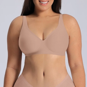 Detailed view of seamless beige bra with wide straps on model for a comfort fit