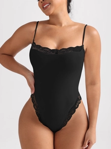 Sexy black lace bodysuit with spaghetti straps and ribbed texture on gray background