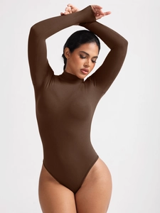 Close-up of deep brown ribbed knit fabric on a long sleeve turtleneck bodysuit