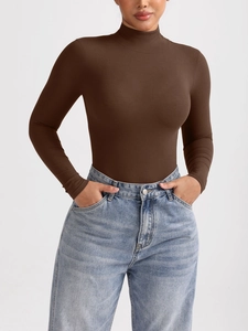 Detail of mock neck ribbed knit bodysuit in coffee brown with slim long sleeves