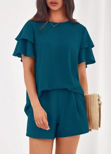 Detail view of peacock blue set with double-layered ruffle sleeves and textured summer fabric