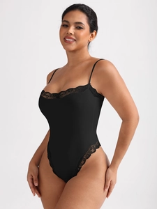 Close-up of elegant black bodysuit featuring delicate lace trim and fine ribbed texture