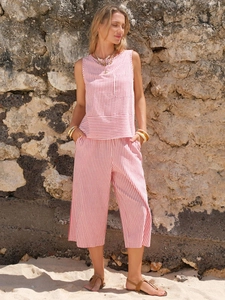 Detail of red and white striped sleeveless top with pocket and wide-leg cropped pants