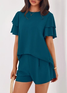 Detail of dark teal two-piece set featuring pleated texture and ruffled short sleeves