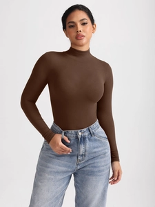 Detail of brown ribbed knit turtleneck bodysuit with long sleeves and seamless finish