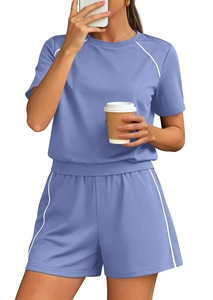 Detail of lavender short set featuring white contrast piping and elastic waistband