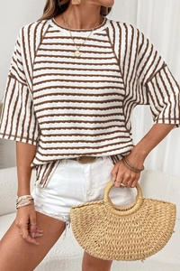Detail showing wavy textured knit fabric of the brown and white striped summer t-shirt