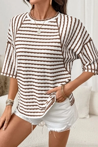 Detail of waffle texture brown striped t-shirt with crew neck and loose fit design