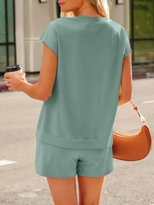 Detailed knit texture of sage green lounge set with V-neck top and shorts