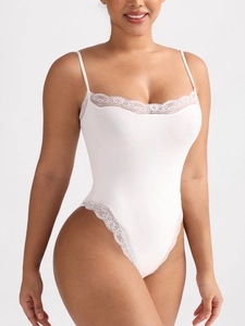 Sexy white lace bodysuit with thin straps and high-cut leg for a slim fit appearance