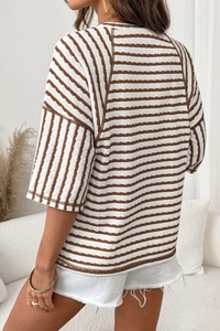 Detail view of striped crewneck t-shirt fabric texture and relaxed drop shoulder design