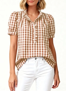 Detailed view of gingham short sleeve shirt with ruffle trim and buttoned stand collar