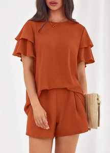 Detailed texture of brick red wrinkled fabric and double-layered ruffle sleeves