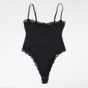Detail view of black lace bodysuit featuring delicate eyelash trim and adjustable straps
