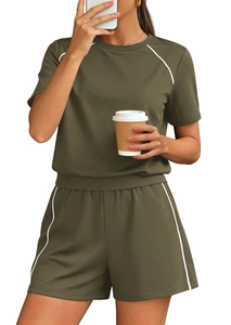 Detail of olive green two-piece lounge set featuring white side stripe and crew neck
