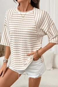Close-up of brown and cream striped t-shirt with unique crinkle texture fabric