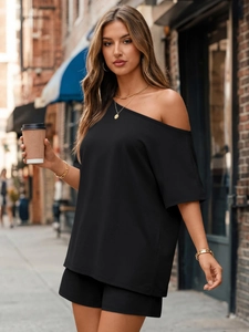 Detail of black one-shoulder short-sleeved top and matching casual shorts for women