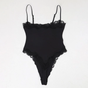 Flat lay of black lace bodysuit featuring eyelash lace trim and adjustable thin straps