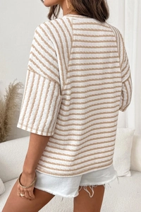 Detail view of the waffle textured fabric and brown stripes on this casual crewneck t-shirt
