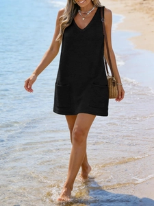 Detail view of black waffle knit sleeveless V-neck beach dress with two front pockets