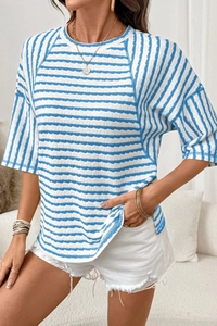 Detail of blue and white striped raglan t-shirt with unique ripple texture fabric